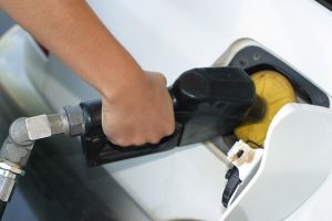 Purchase filling a white car with gas