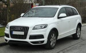 White Audi Q7 parked on a road front facing view