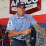image of smiling, friendly AAMCO mechanic.