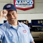 image of smiling AAMCO mechanic welcoming you.