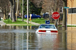 image of car at stop sign flooded intersection 1024