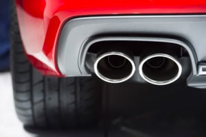 image of dual chrome automobile exhaust pipes