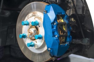 AAMCO Colorado Brake Services - Safe and Reliable Brakes image of disc brake assembly on a modern automobile.