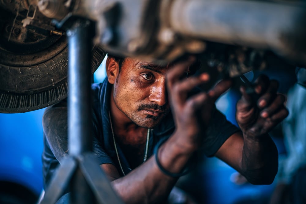 Mechanic operating on a vehicle