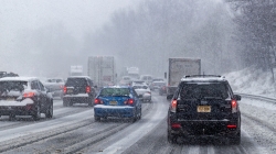 image of cars driving in snowing conditions in traffic