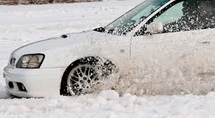 Car drifting in snow 