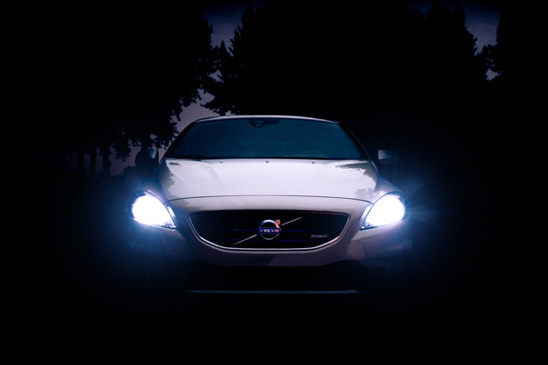 image of front of car in dark with bright lights on