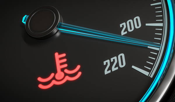 image of a car dashboard with engine temperature warning light